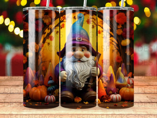 Gnome with pumpkins and fall leaves on a wooden background.