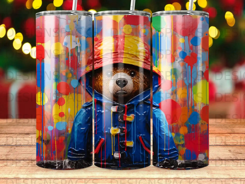 Bear in yellow hat and blue raincoat with colorful paint splatter background.