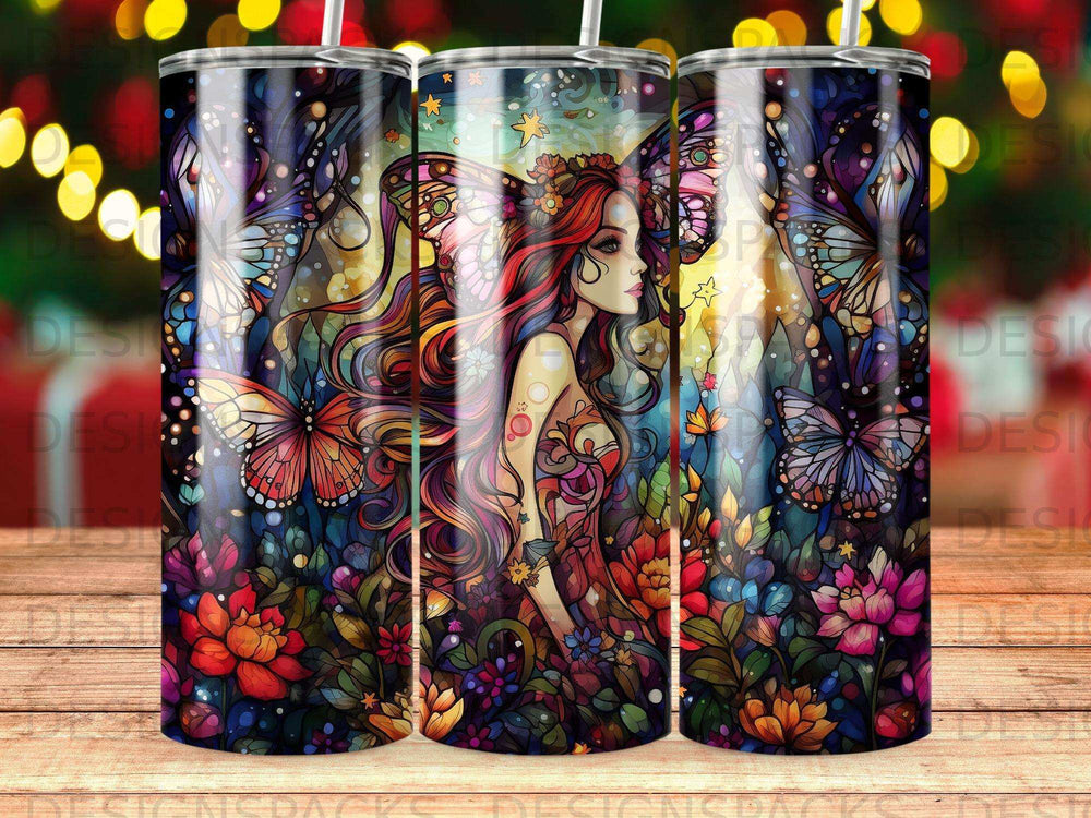 Fantasy tumbler with woman, butterflies, and colorful flowers.