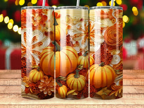 Tumbler with pumpkins, leaves, and floral scrollwork in warm autumn colors.