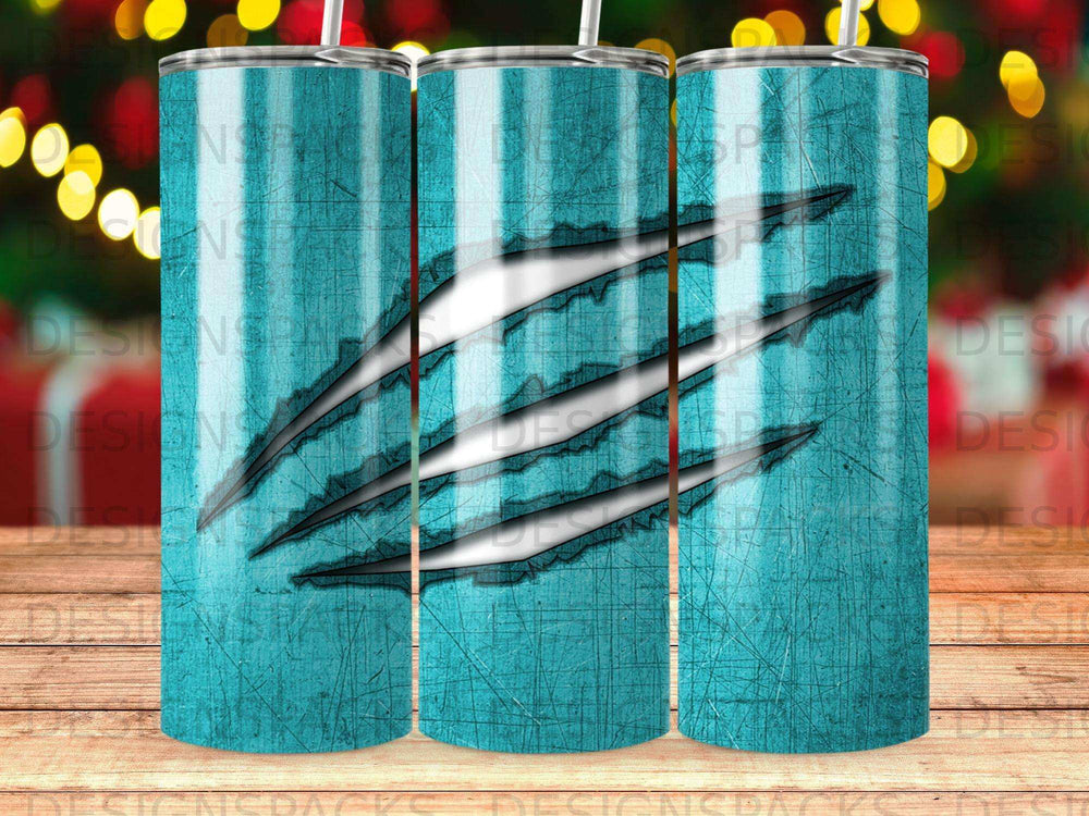 Teal tumbler with claw marks and textured background.