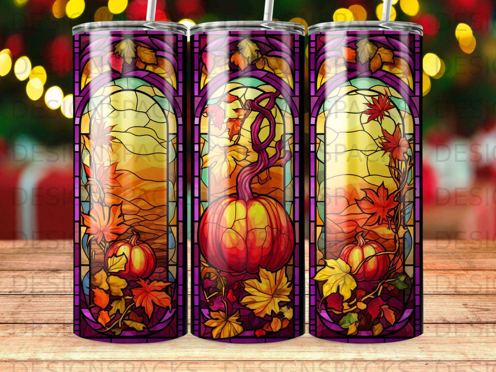 Stained glass tumbler design featuring pumpkins, autumn leaves, and warm lighting.
