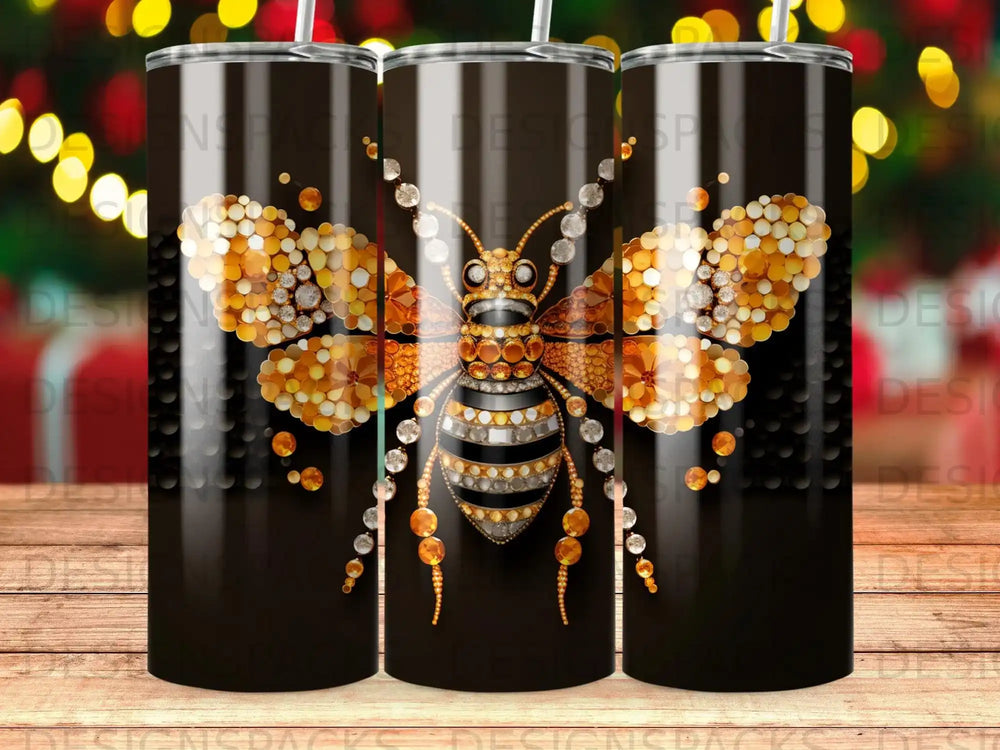 Glittering bee with gem-encrusted wings on a black tumbler.