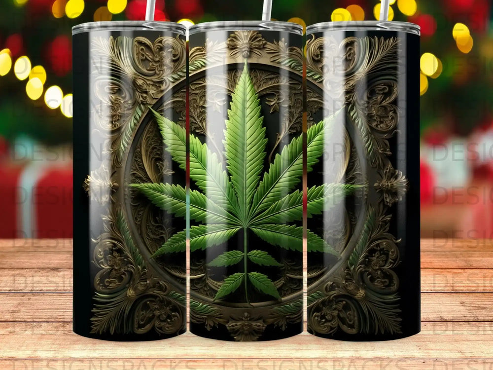 Green cannabis leaf within ornate golden circular frame on a black tumbler.