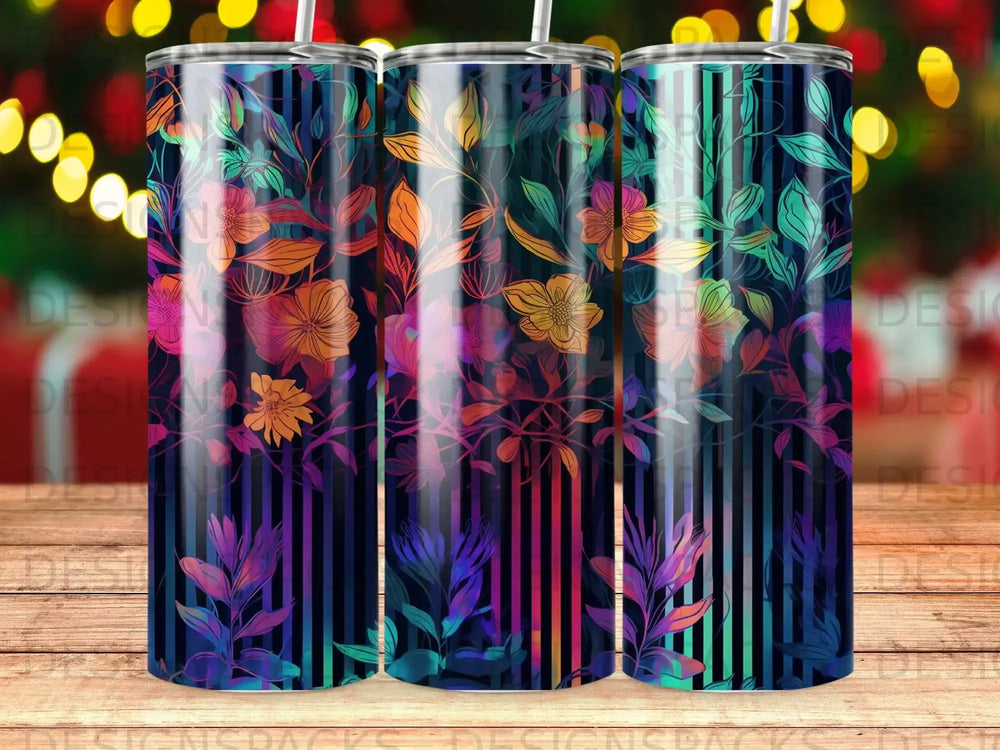 Three tumblers with floral and stripe designs in vibrant colors.