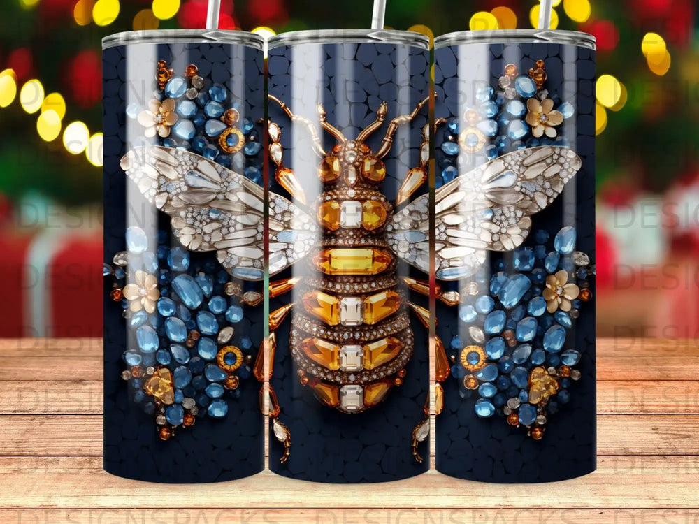 Bejeweled bee design with gold, blue, and clear rhinestones on a dark background.