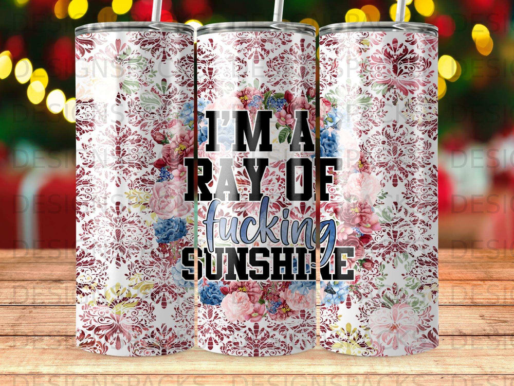 Tumbler with floral pattern and text "I'm a ray of fucking sunshine."
