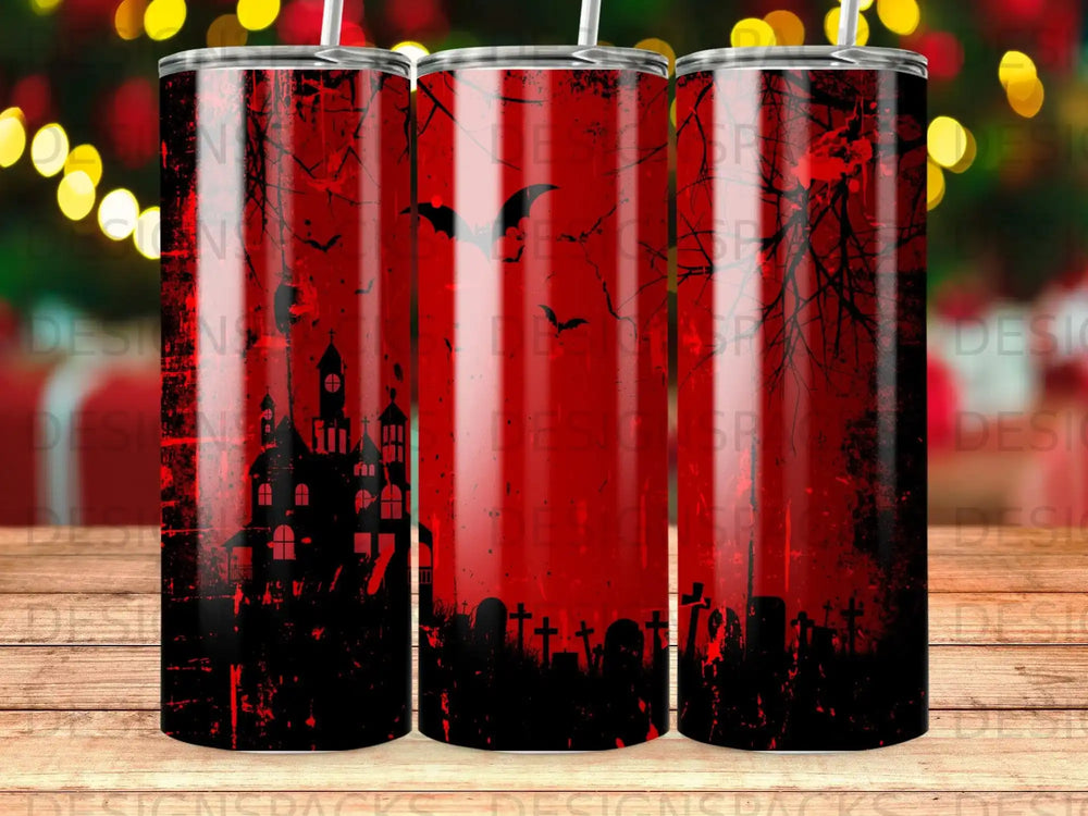 Spooky Halloween tumbler with bats, haunted house, and graveyard graphic.