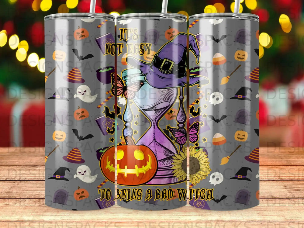 Tumbler with hourglass, pumpkin, witch hat, and "It's not easy to being a bad witch" text.