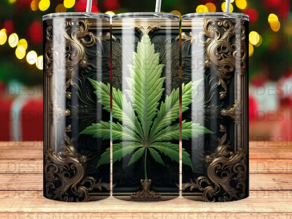 Green cannabis leaf design on a dark, ornate tumbler with bokeh lights in background.