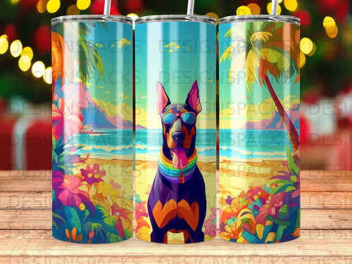 Doberman wearing sunglasses and a rainbow collar on a tropical beach.