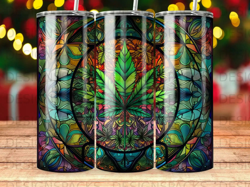 Stained glass tumbler featuring a central cannabis leaf surrounded by colorful geometric patterns.