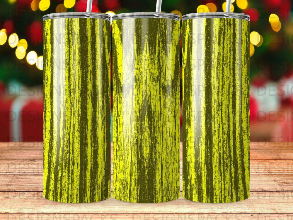 Three yellow textured tumblers with subtle vertical lines against a blurred background.
