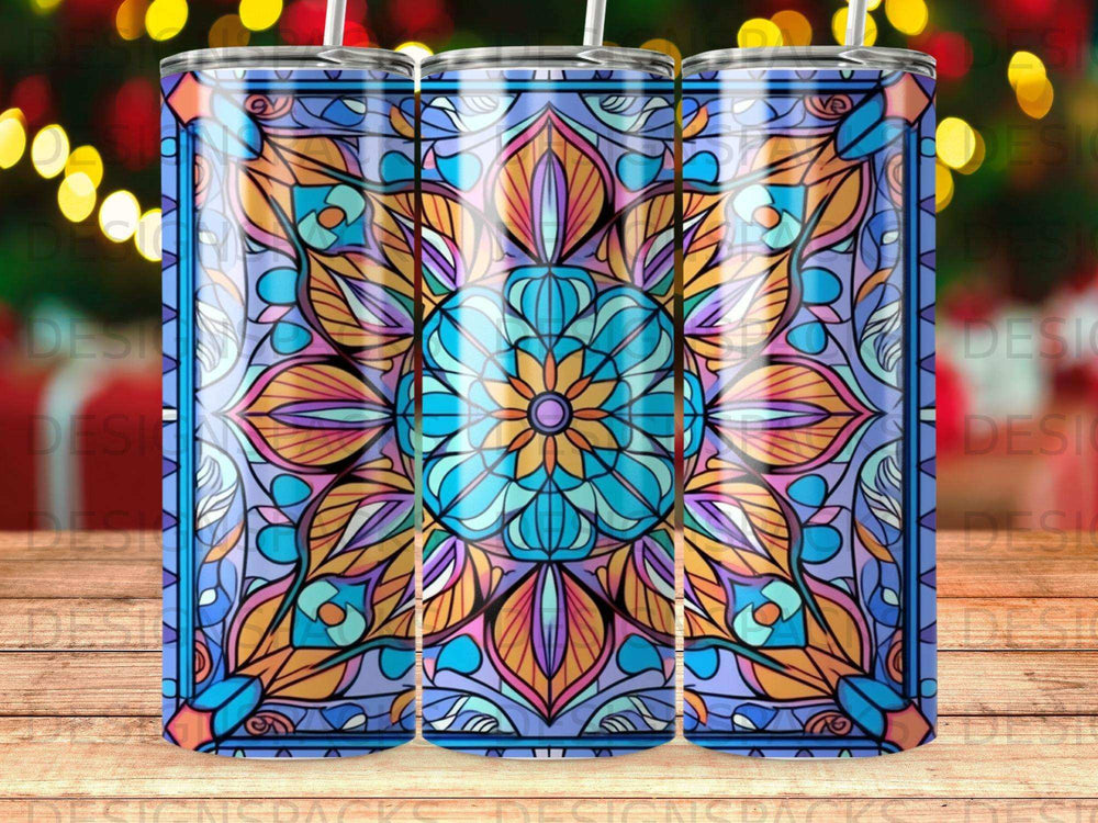 Colorful stained glass mandala pattern tumbler with blurred bokeh background.