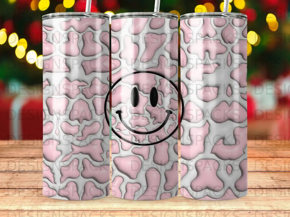 Pink and white cow print tumbler with a smiley face design.