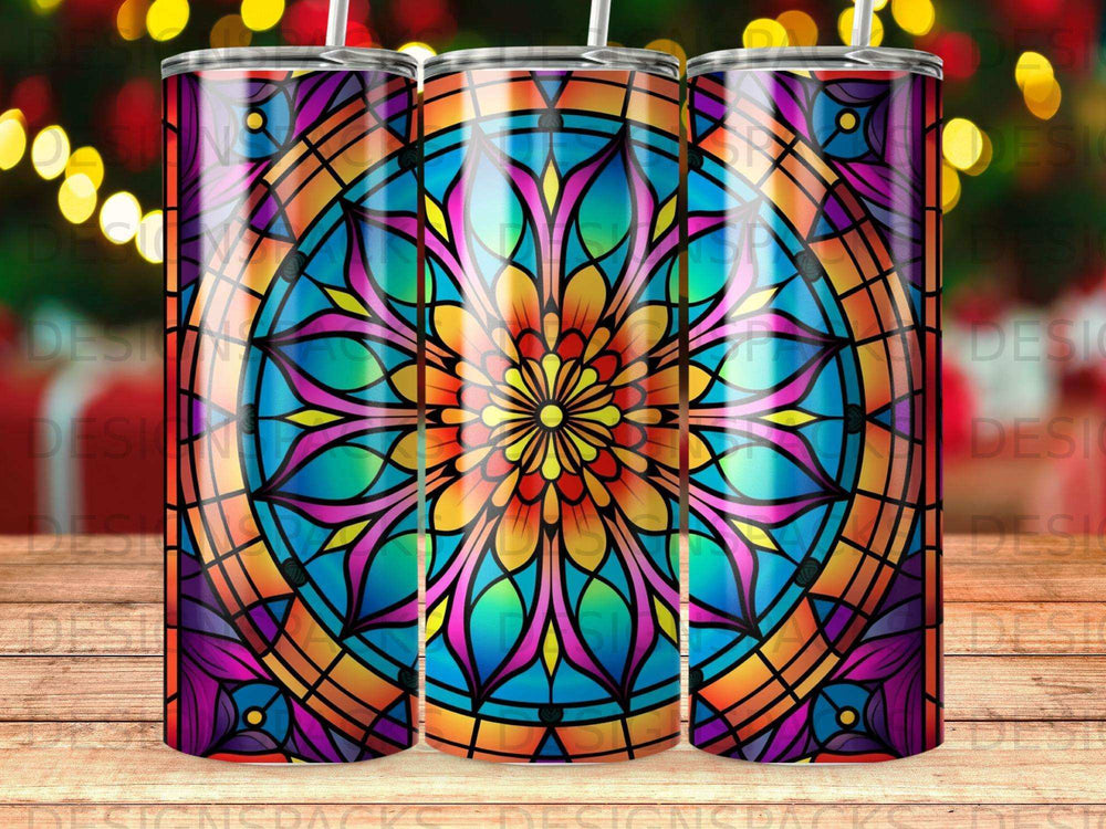 Vibrant stained glass mandala pattern on a tumbler with blurred bokeh background.