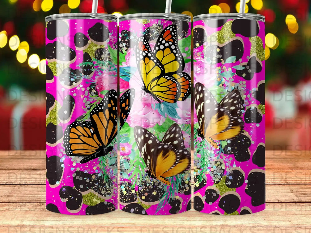 Pink leopard print tumbler with monarch butterflies and glitter accents.