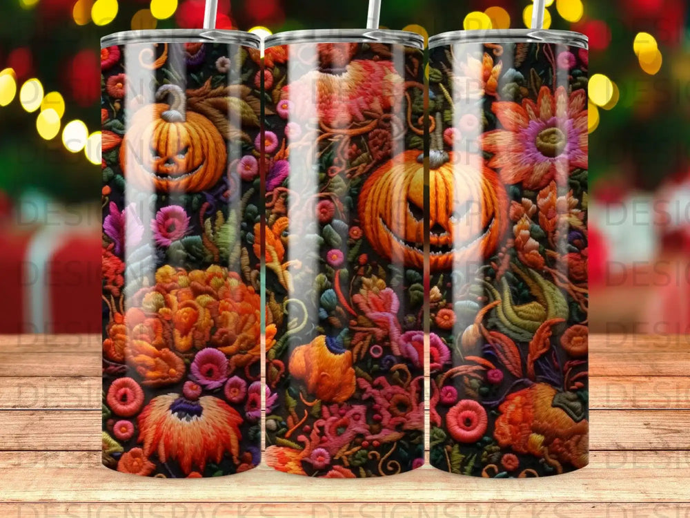 Halloween pumpkins and floral designs on a tumbler.