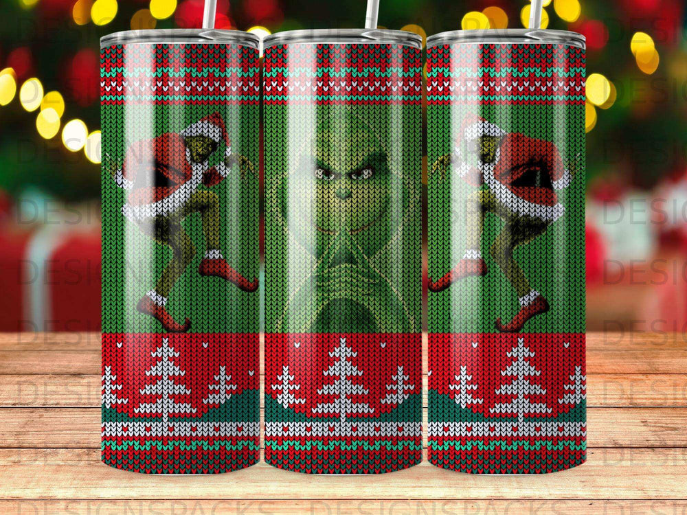 Green Grinch Christmas tumbler with a green knit pattern and red trim.