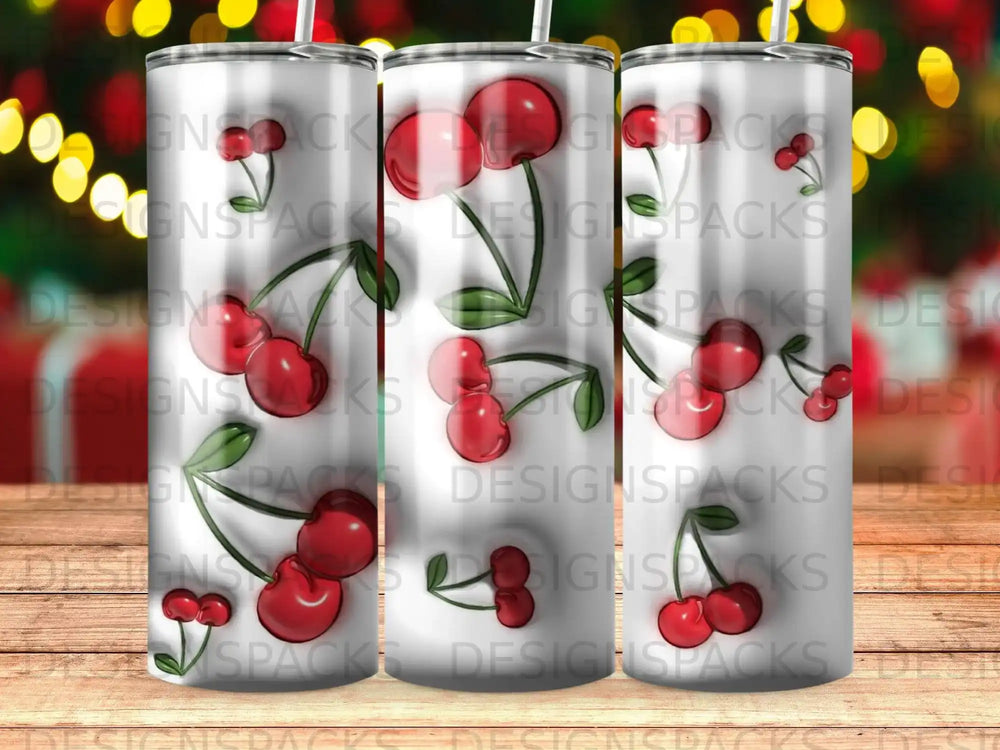 Tumbler with repeating cherry pattern and "DESIGNSPACKS" watermark.