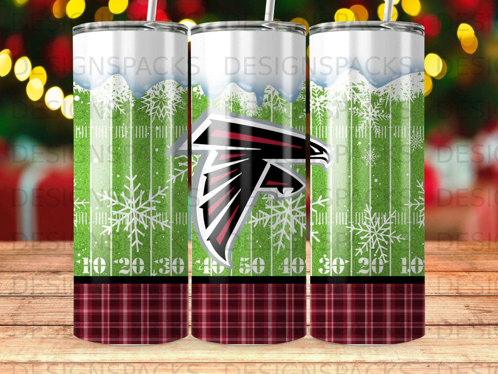 Atlanta Falcons logo on a tumbler with plaid and snowflake background.