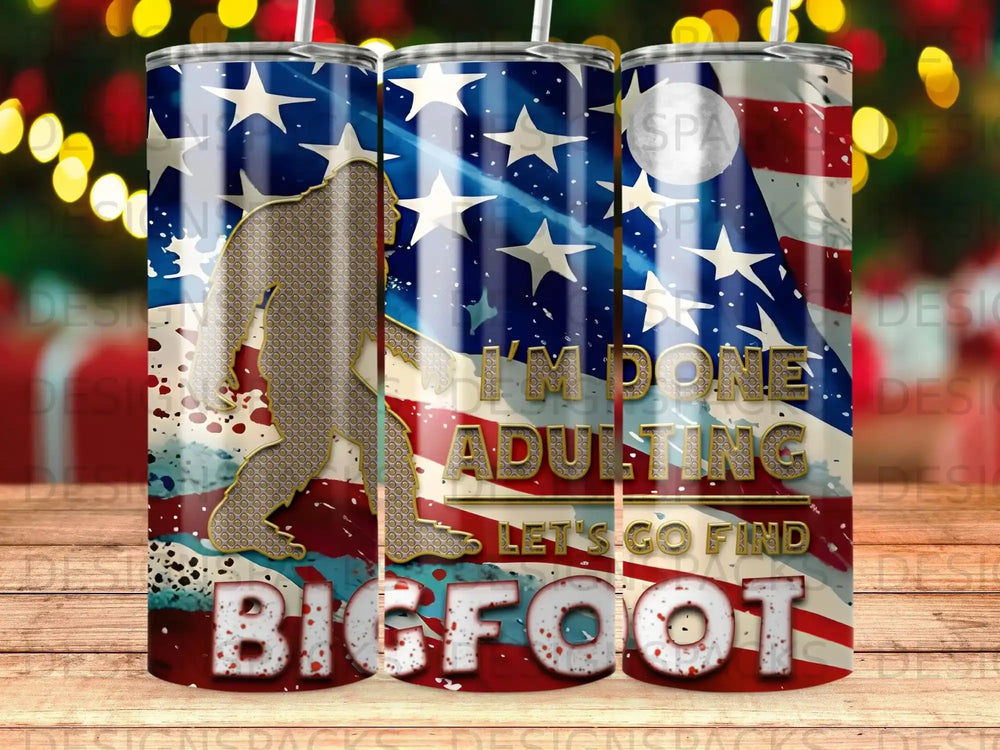 Tumbler with Bigfoot silhouette and American flag, "I'm Done Adulting, Let's Go Find Bigfoot" text.