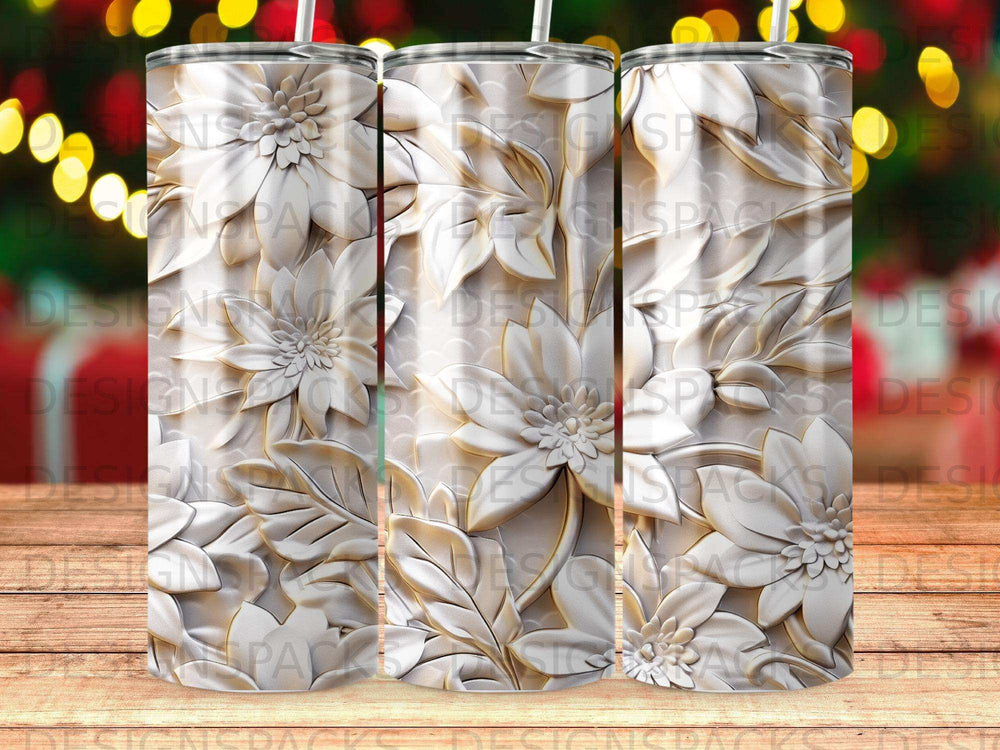 White embossed floral pattern on a tumbler against a bokeh background.