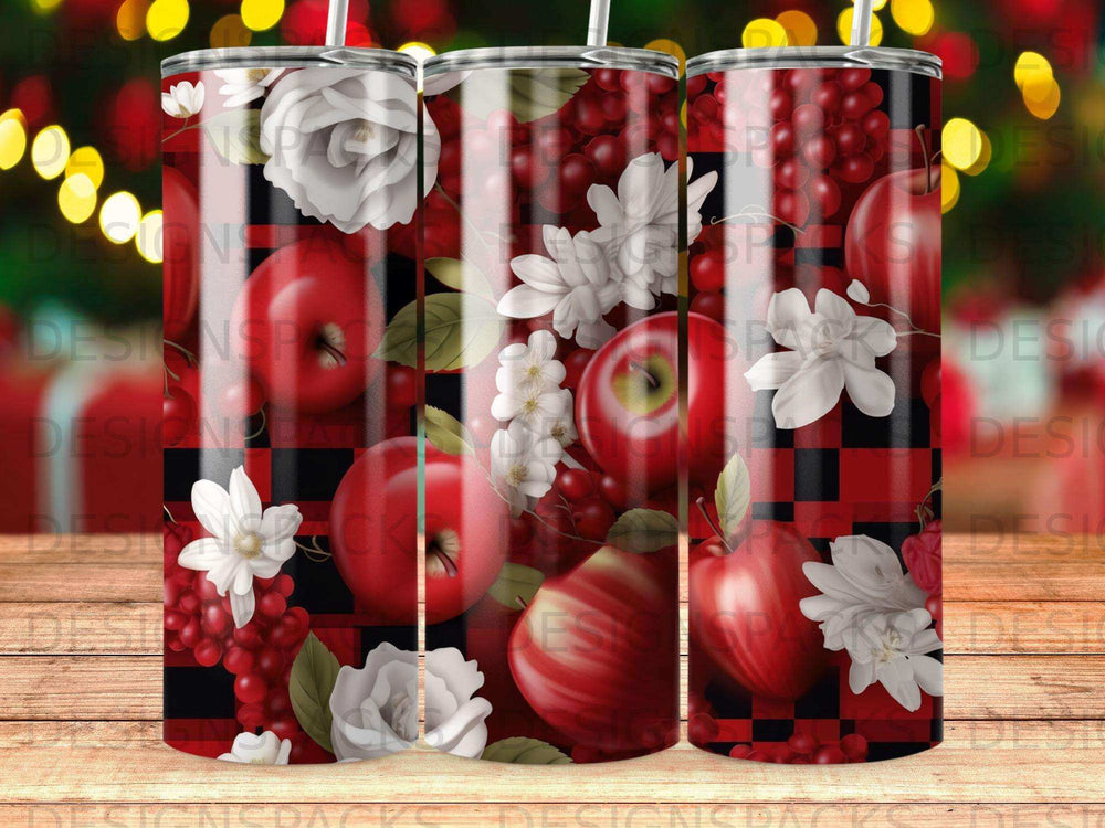 Red apples and white flowers on a plaid background.