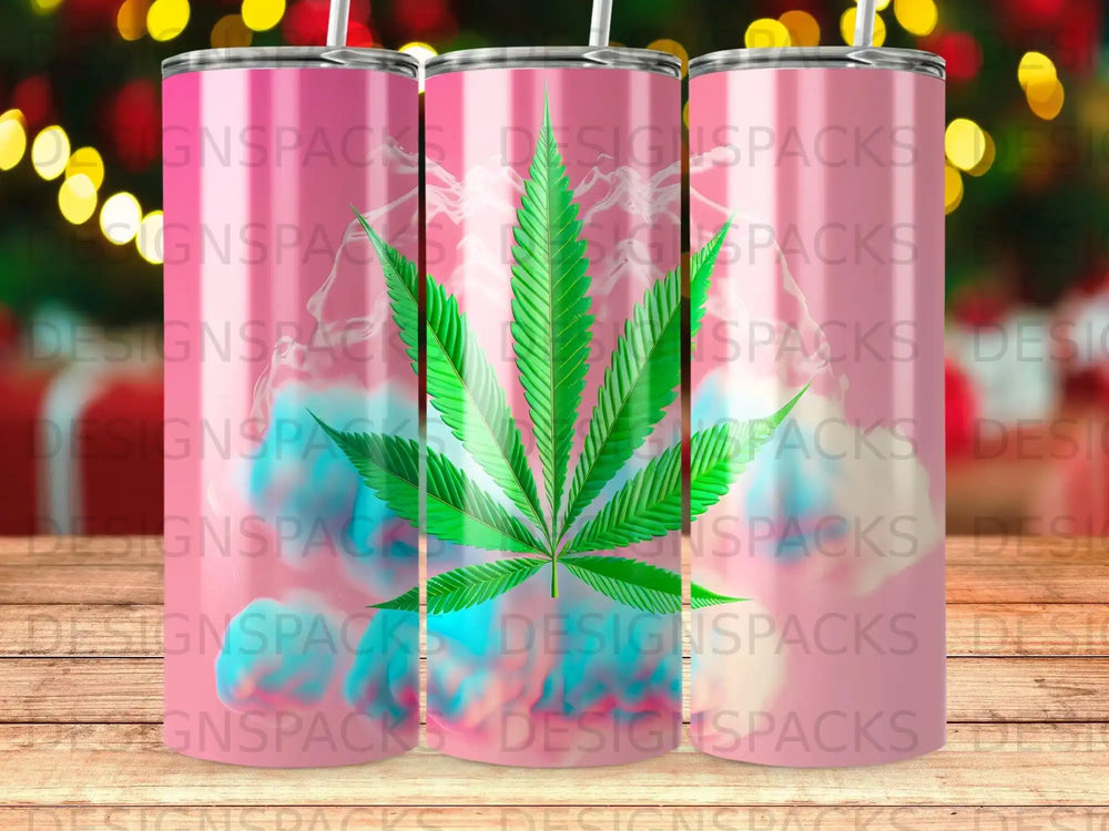 Pink tumbler with cannabis leaf graphic and repeating "DESIGNSPACKS" text.
