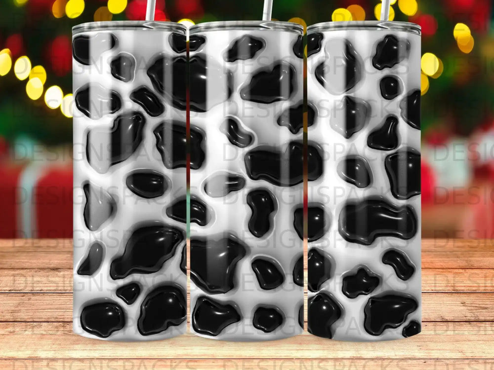 Black and white cow print tumbler with raised textures.