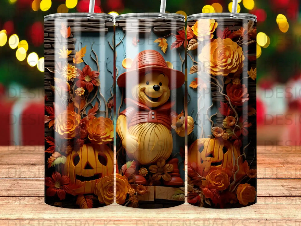 Winnie the Pooh with pumpkins and autumn flowers on a tumbler.