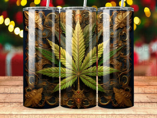 Gold cannabis leaf design on a dark blue tumbler with ornate swirling patterns.