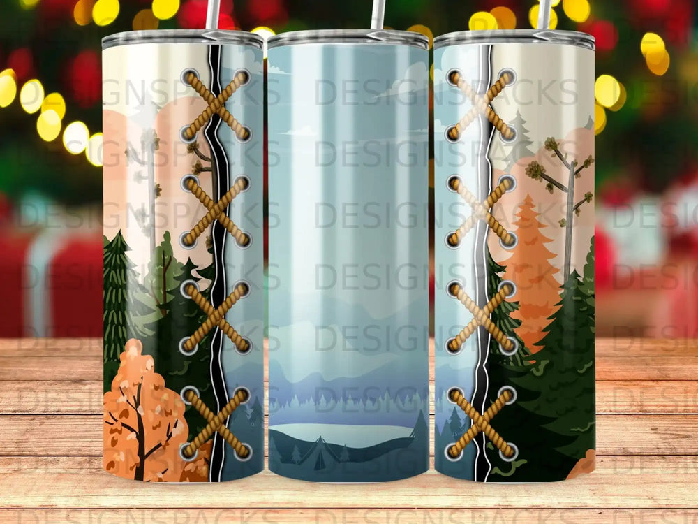 Tumbler with forest and mountain landscape design and brown lacing detail.