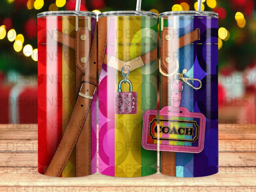 Three Coach tumblers with pastel ombre designs and gold accents.