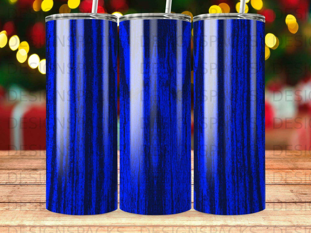 Three blue striped tumblers with bokeh background.