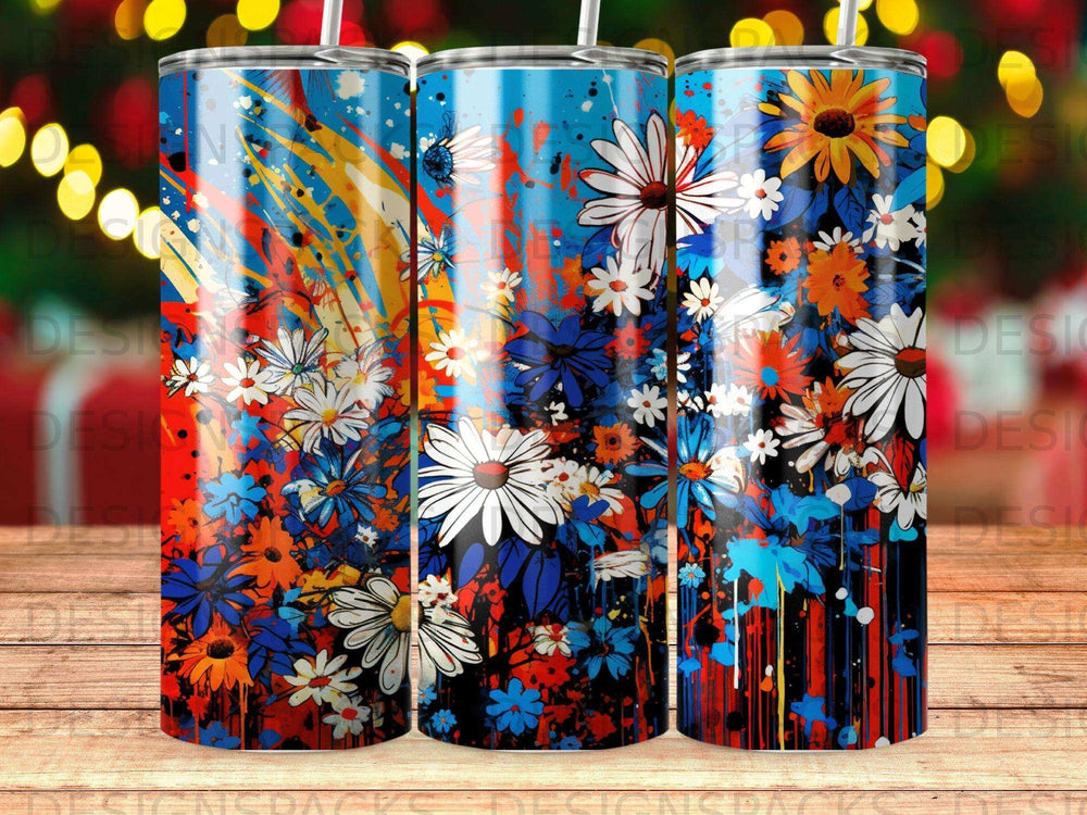 Blue, white, and orange floral pattern with paint splatters on three tumblers.