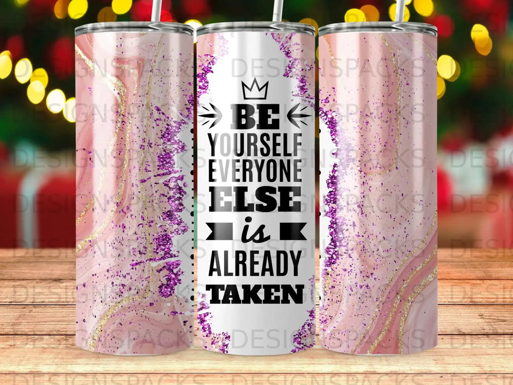 Tumbler with "Be yourself, everyone else is already taken" text on sparkling pink background.