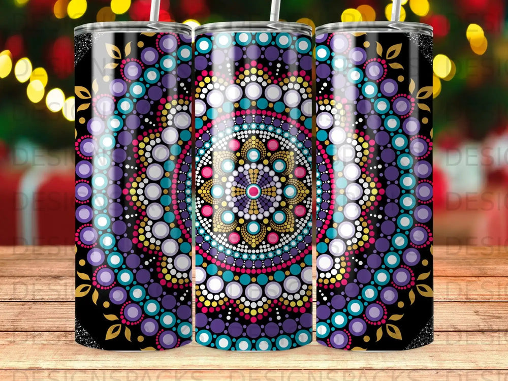 Three tumblers with colorful mandala designs and a bokeh background.