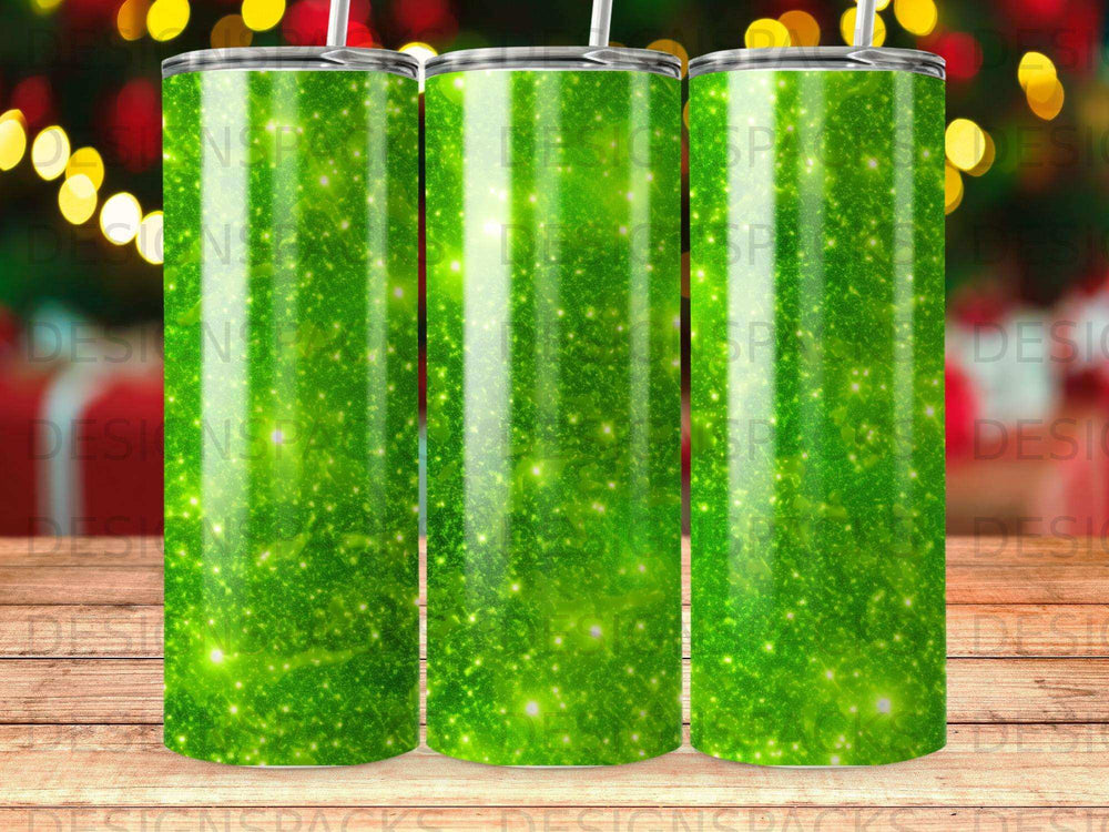 Green glitter tumblers with festive bokeh lights background.