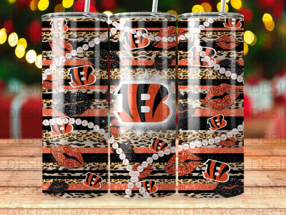 Tumbler with leopard print, black and white stripes, red lips, and white beads.