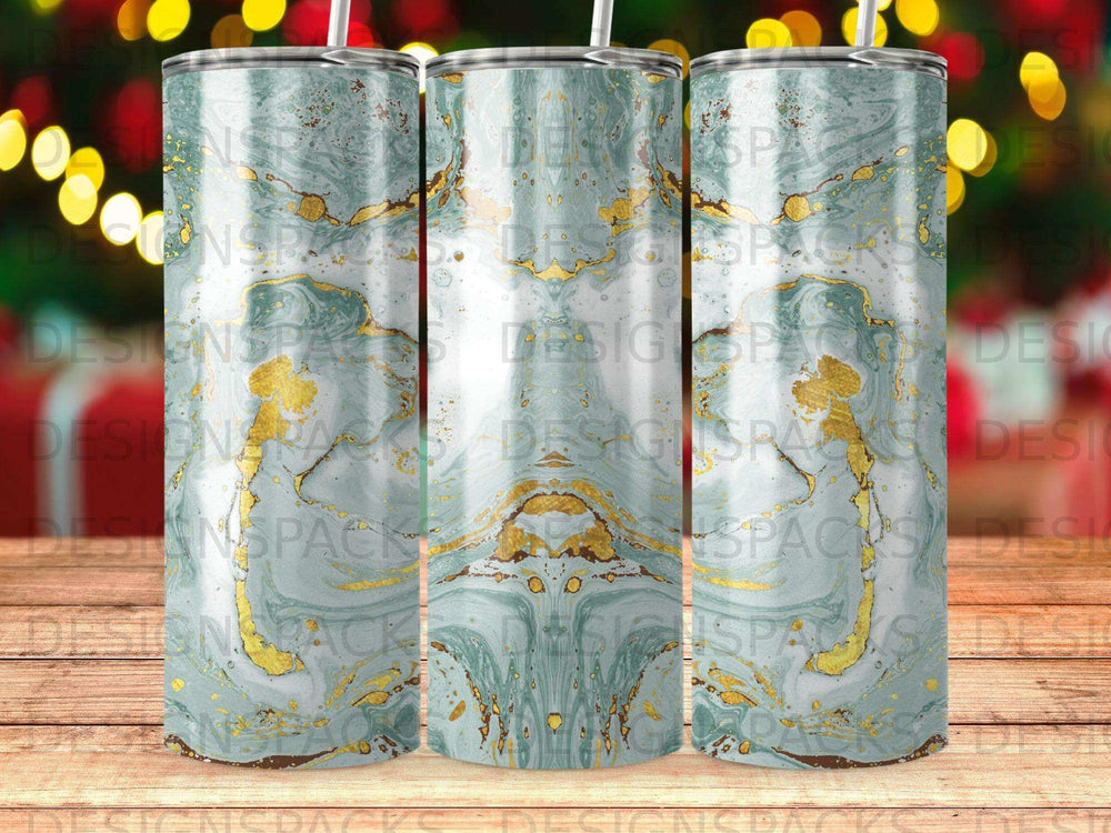 Green marble tumbler with gold accents and a wooden background.
