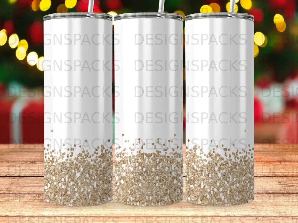 Three tall, white tumblers with glitter ombre design.