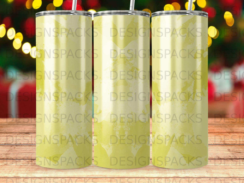Three tumblers with a yellow and white abstract pattern and "DESIGNSPACKS" watermark.