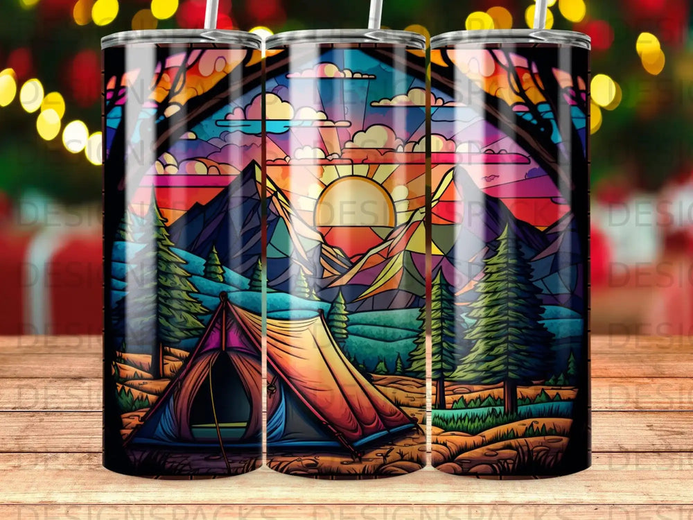 Stained glass scene of a tent and mountains at sunset.