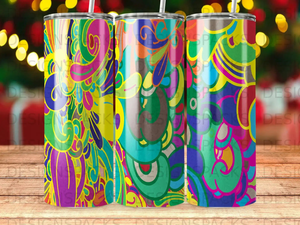 Three tumblers with vibrant, abstract colorful patterns displayed side-by-side.