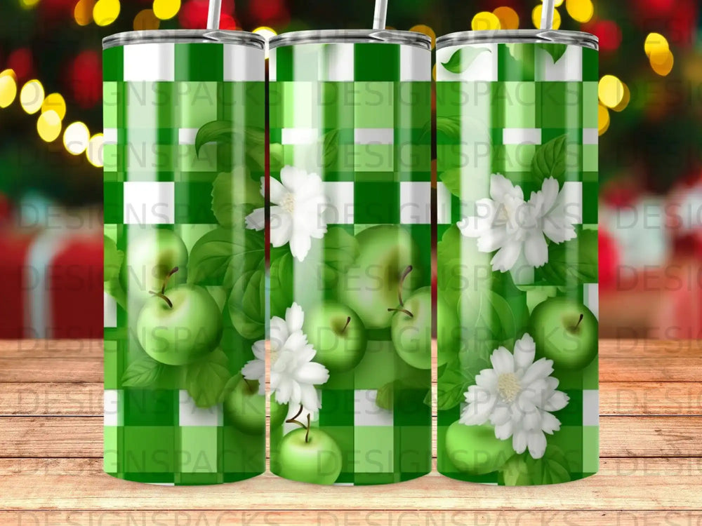 Green apples and white flowers on a plaid background.