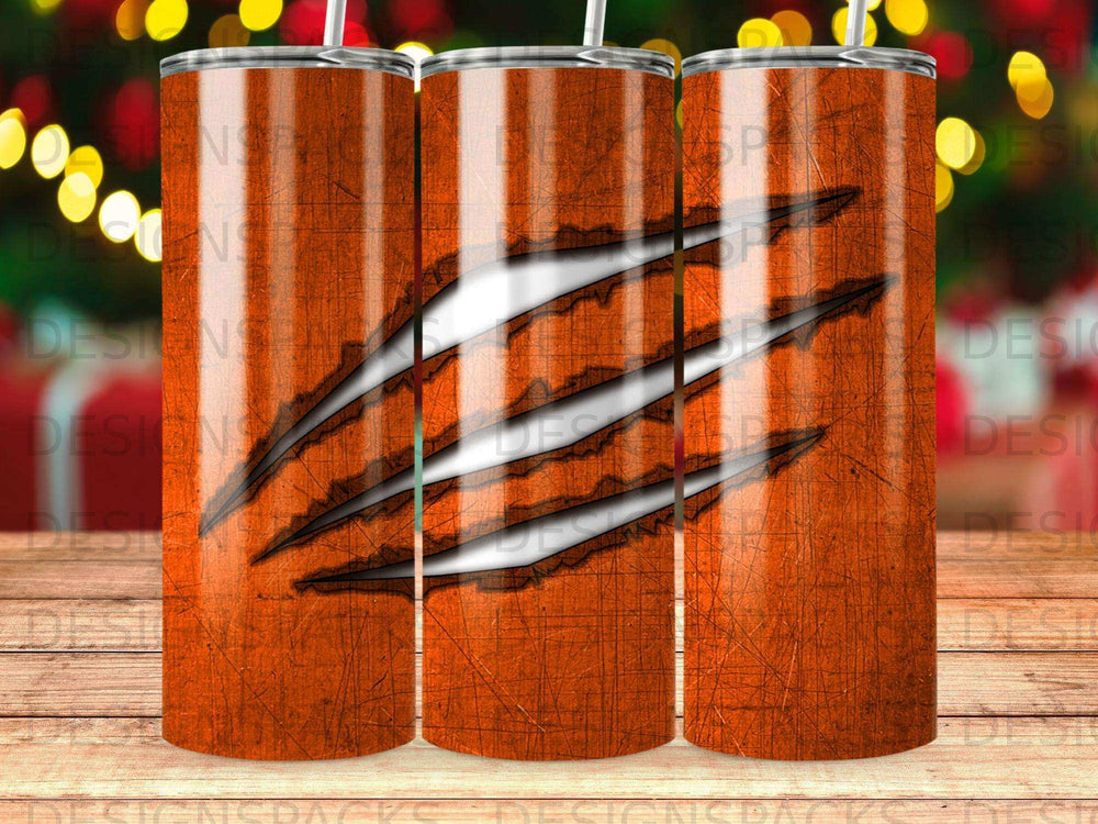Orange tumbler with tiger claw marks design.