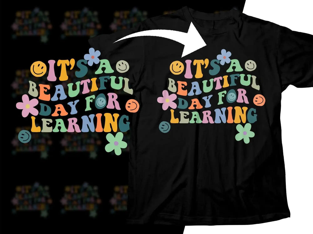 Black t-shirt with colorful 'It's a Beautiful Day for Learning' design, flowers, and smiley faces