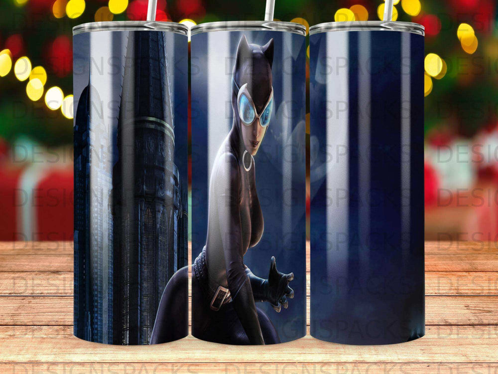 Catwoman in a black costume and goggles on a tumbler.