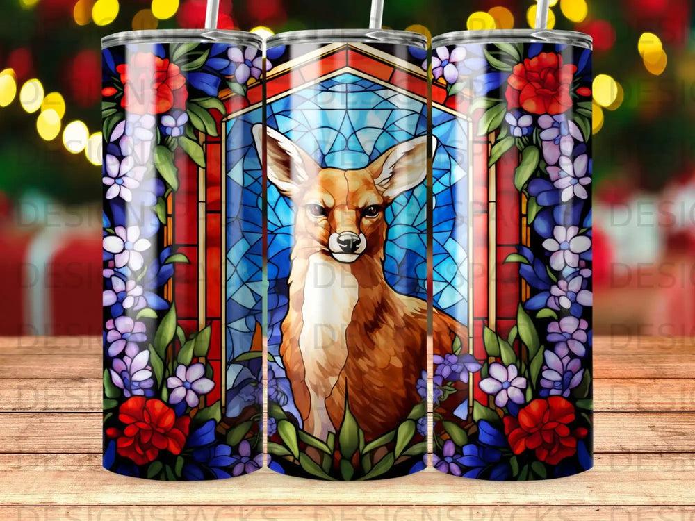 Stained glass art of a deer with flowers and a geometric background.